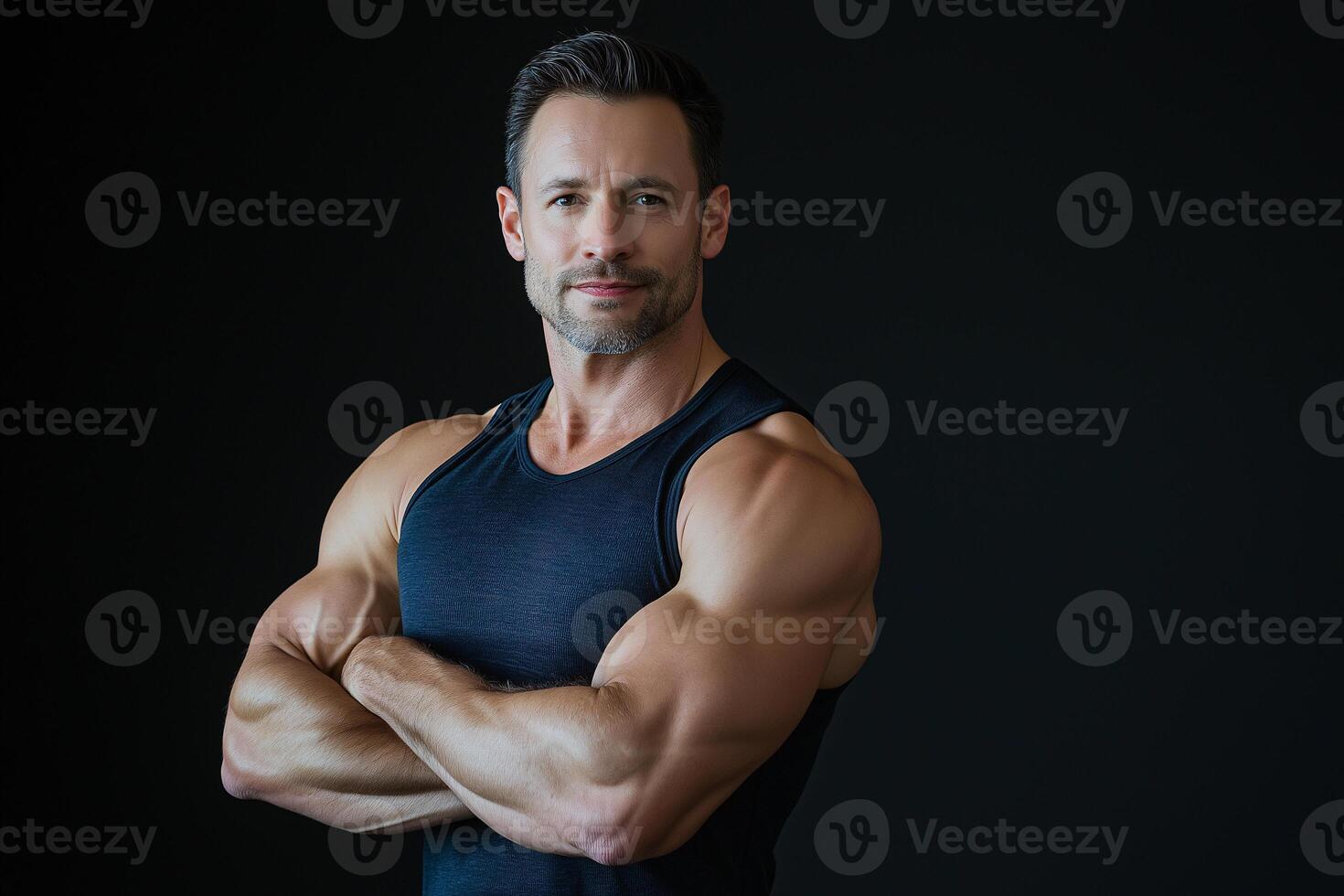 A man in a tank top posing for the camera photo