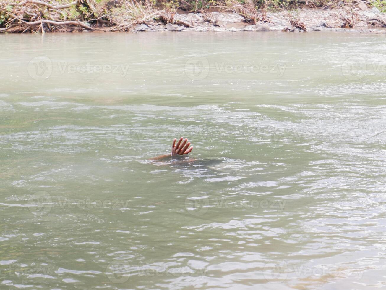 river water with one's hands. concept of people in river photo