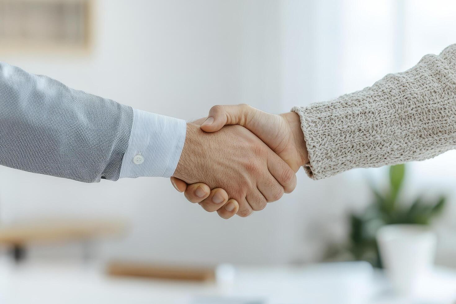 Hands shaking in agreement, symbolizing partnership and collaboration. photo