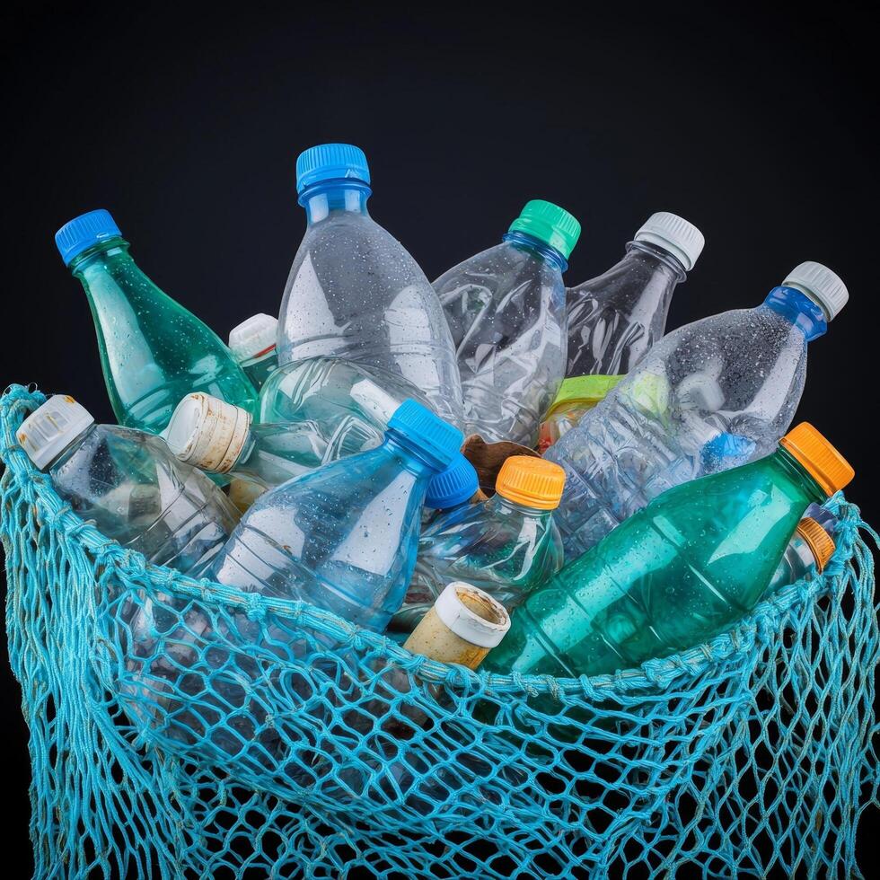 Overflowing plastic bottles in a netted container. photo