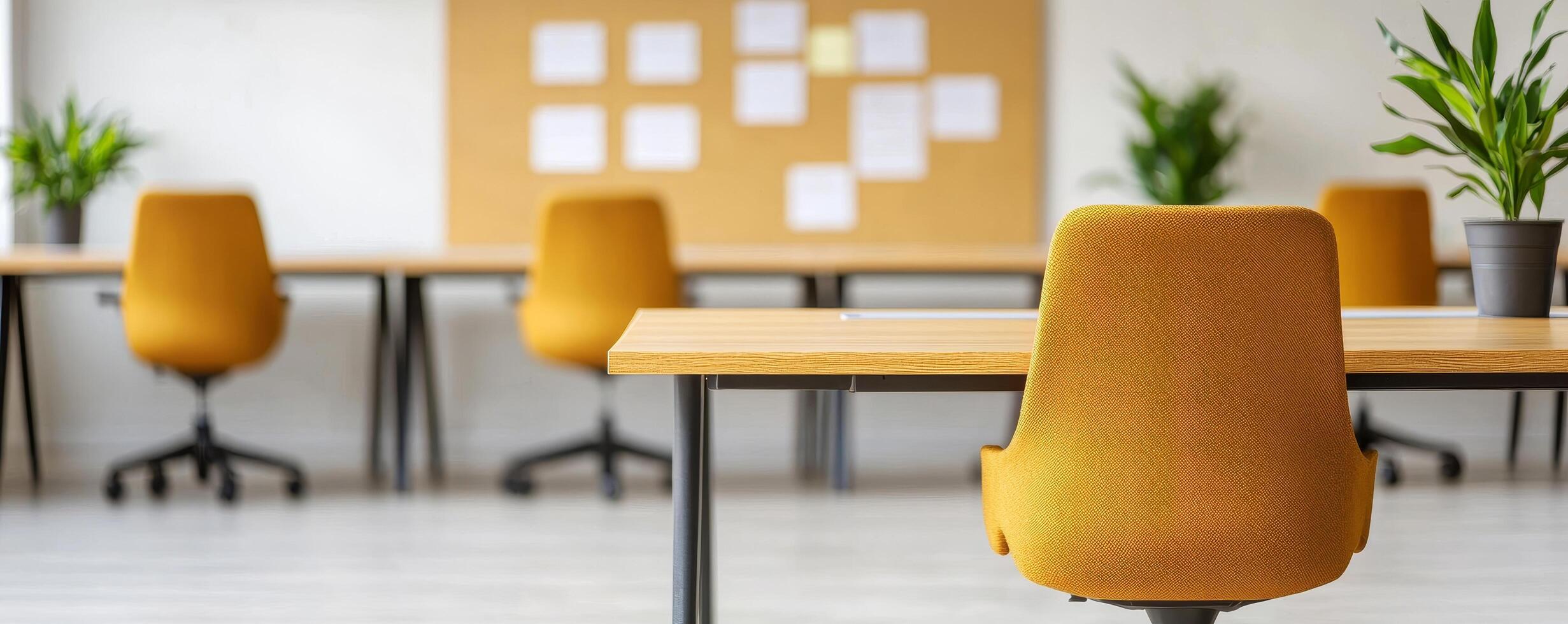 Modern office with yellow chairs and a clean workspace design. photo