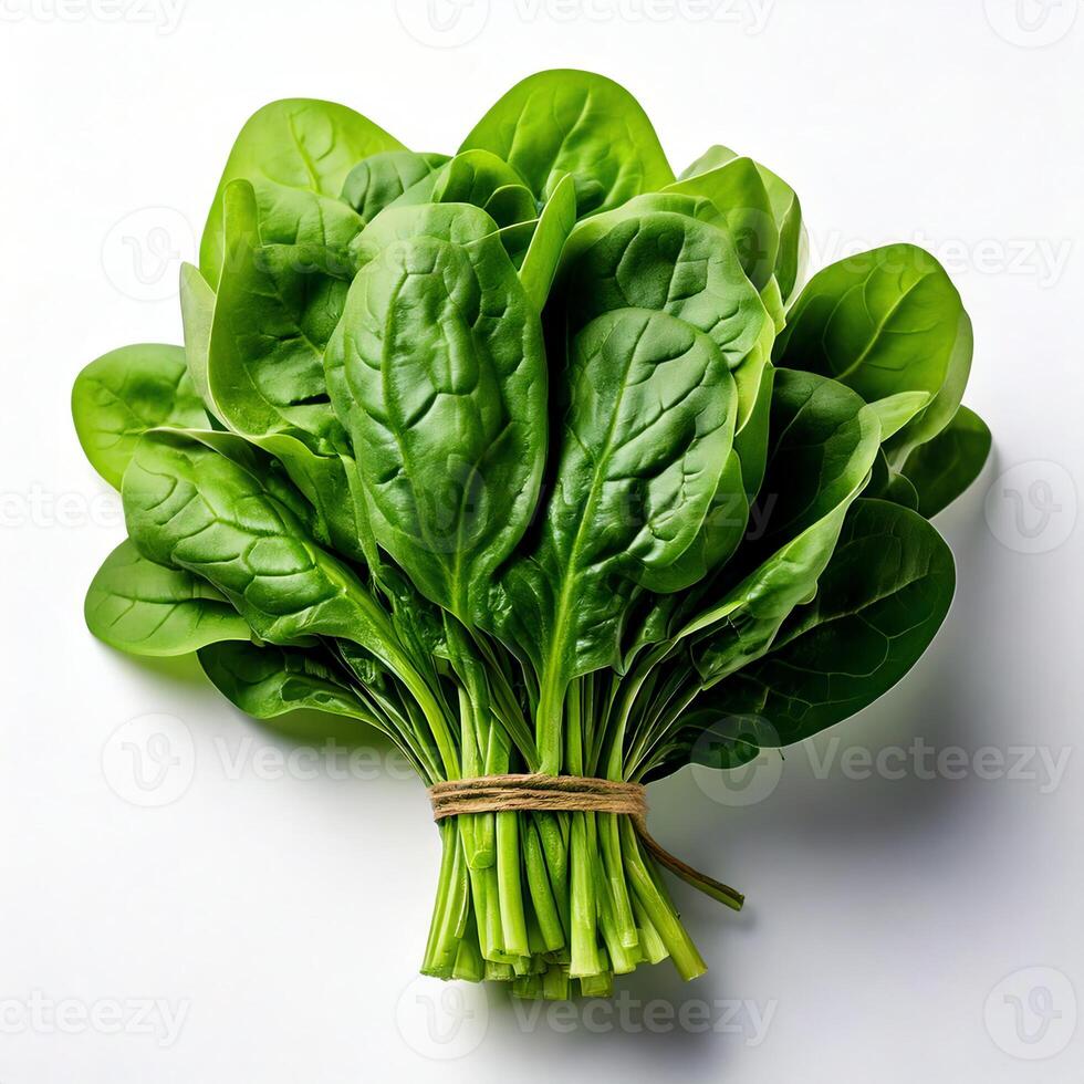 Spinach leaves are tied together on a white surface photo