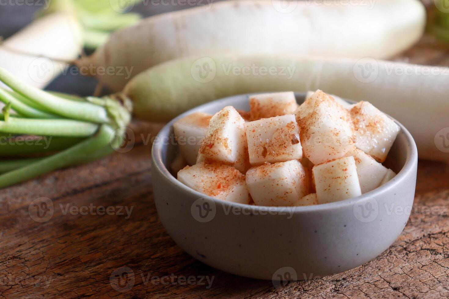 Kimchi radish in small bowl. photo