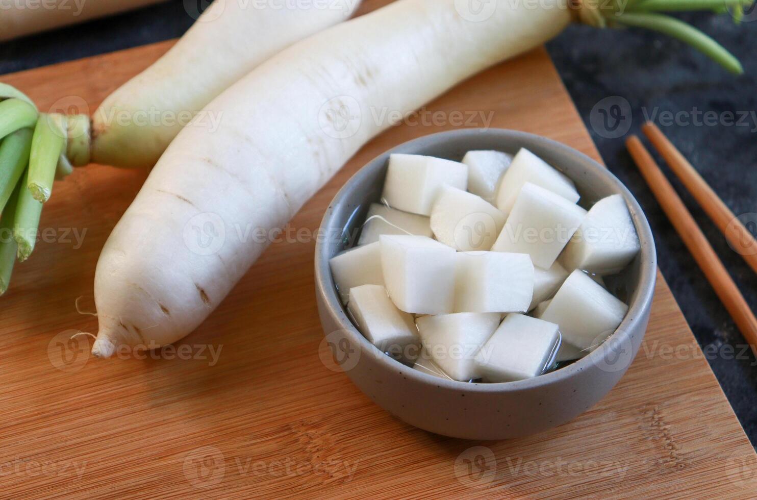 Pickled white radish in small bowl. photo