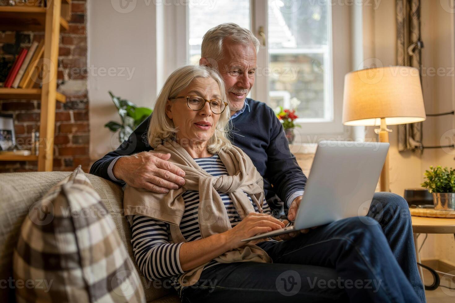 Couple enjoys a cozy afternoon together, sharing laughter and stories while using a laptop in their comfortable living room photo