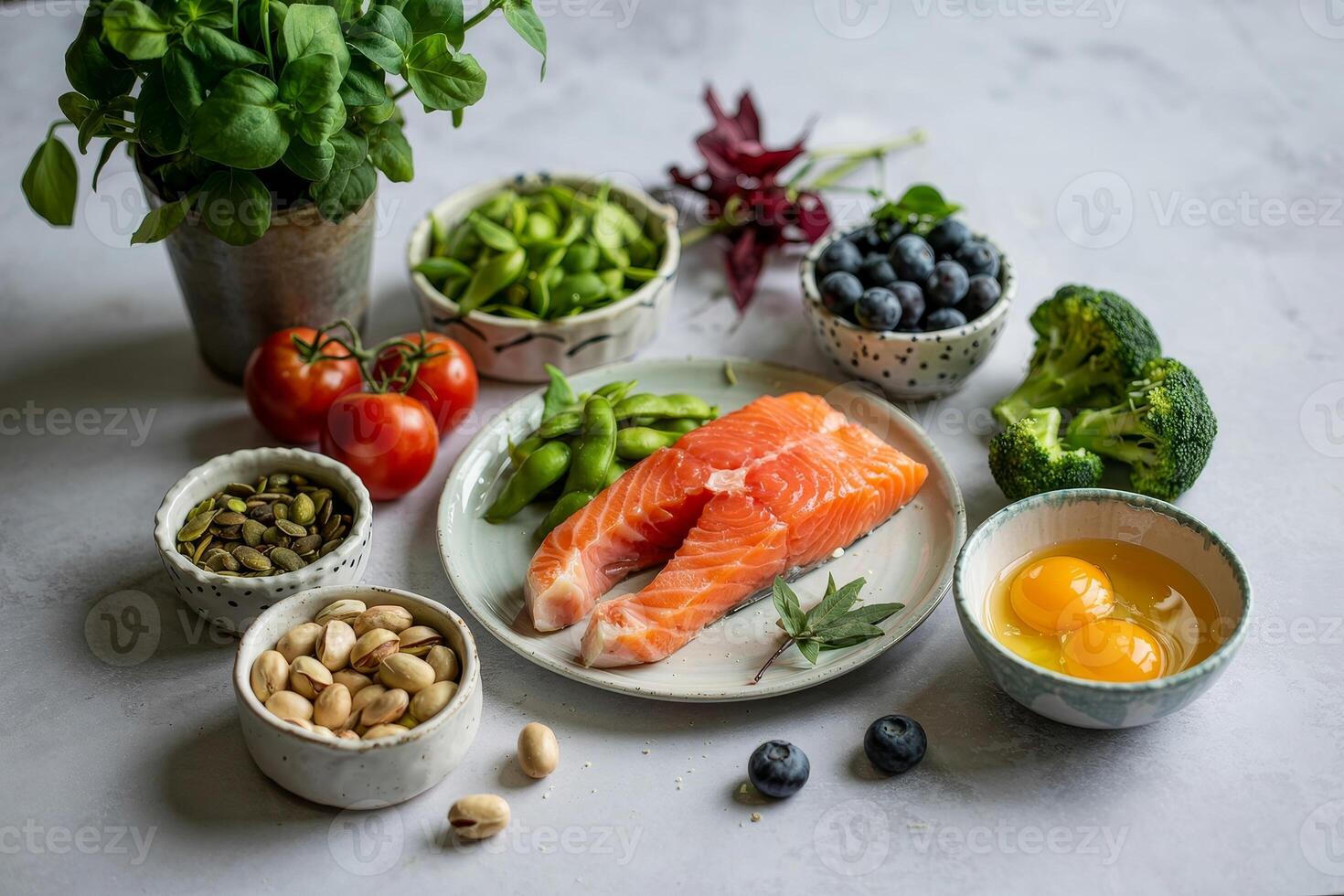 Fresh salmon fillet accompanied by vibrant vegetables and nuts on a light gray background creates a healthy culinary display photo