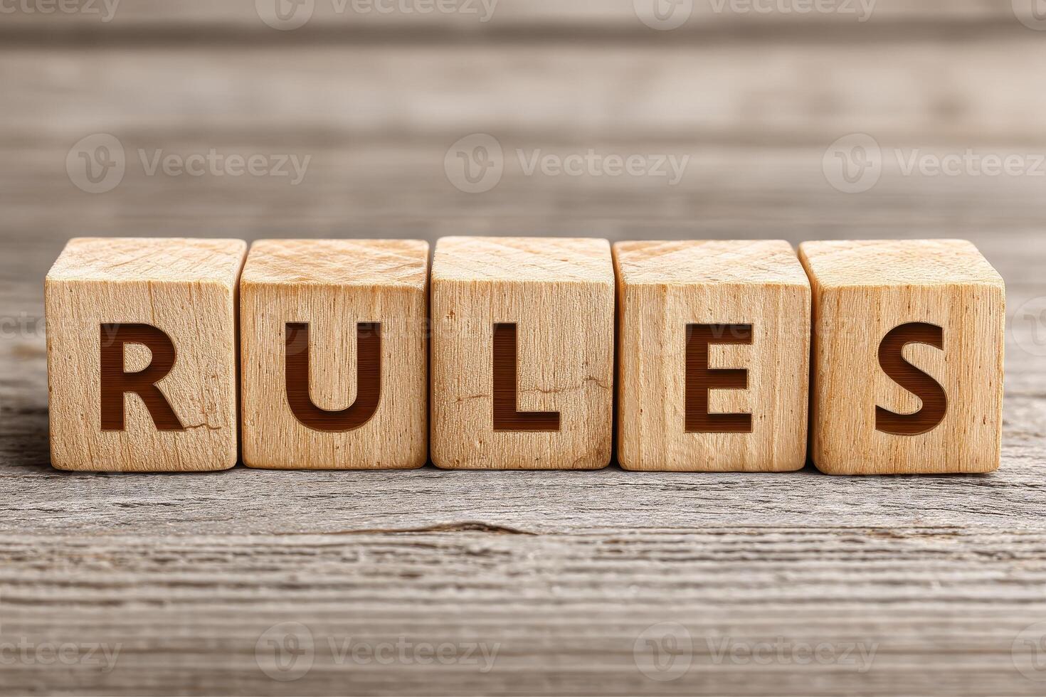Crafted wooden tiles spell out rules, displaying artistry in simplicity and elegance on a rustic wooden surface photo