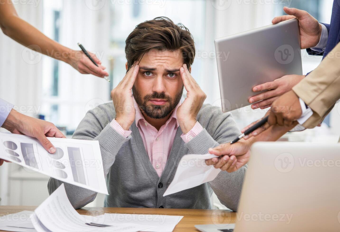 Professional man under pressure manages multiple tasks in cluttered office environment photo