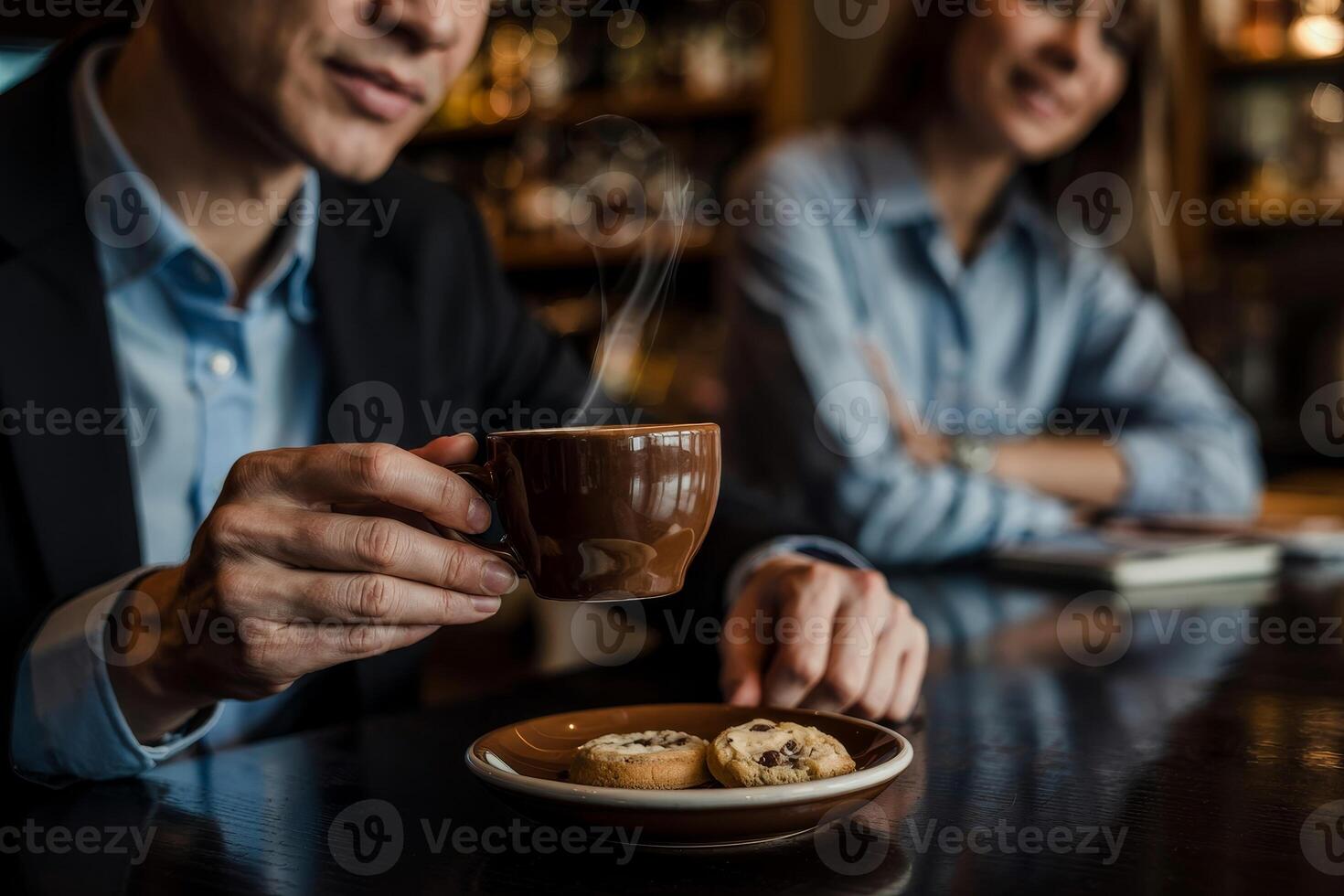 Contemplation over coffee and cookies at a cozy bar setting during a relaxed afternoon photo