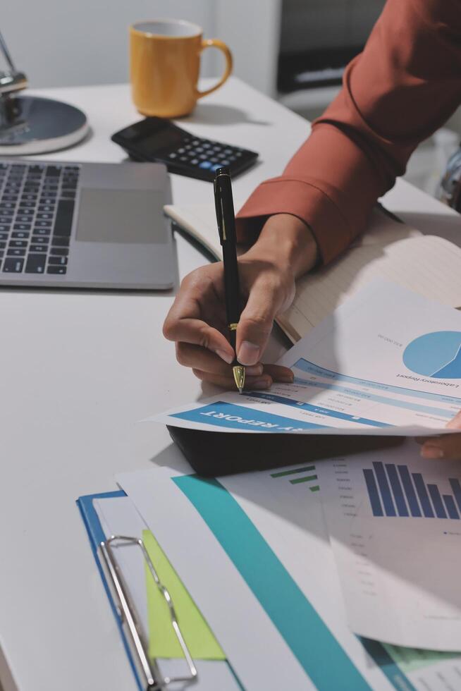A business owner is working on a spreadsheet photo