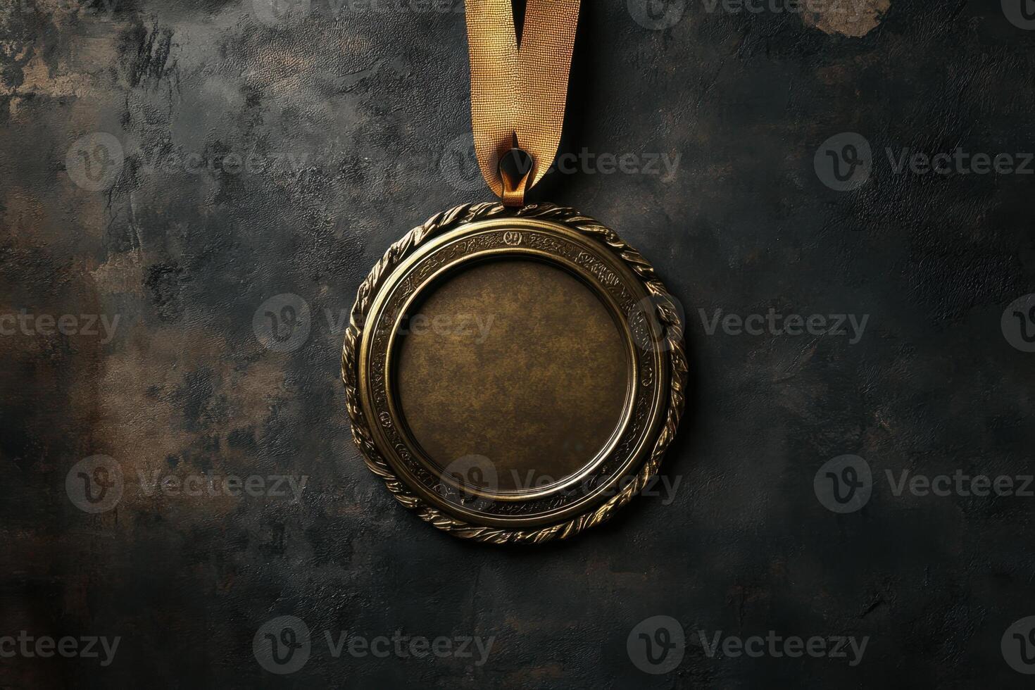 A gold colored medal with a ribbon hanging from it photo