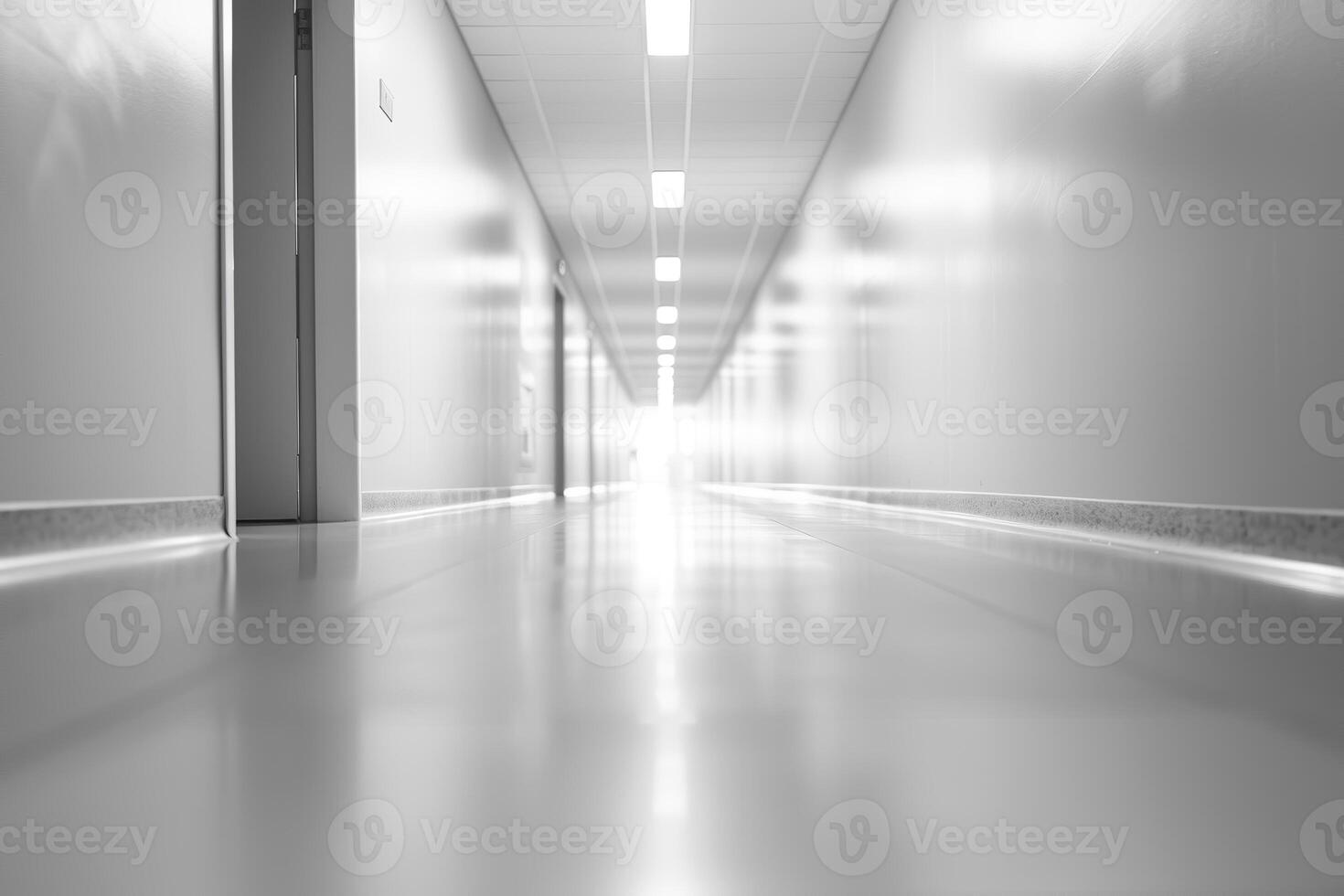 Blurred Corridor in Modern Office Building with Bright Lighting and Polished Floors photo