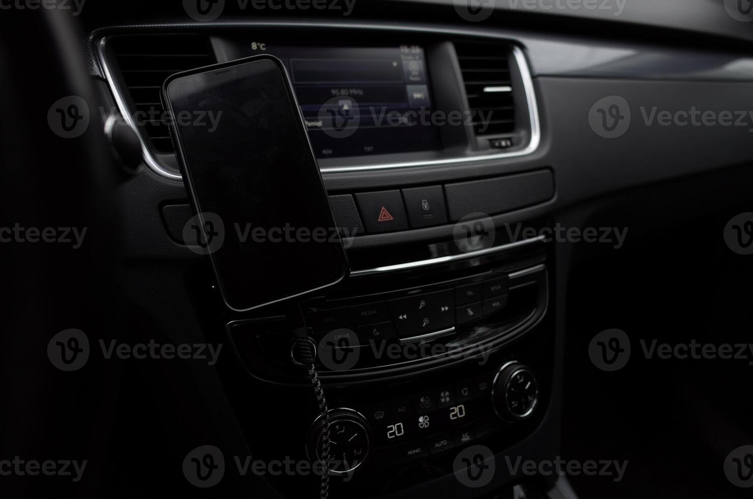 Black car with a phone holder on the dashboard photo