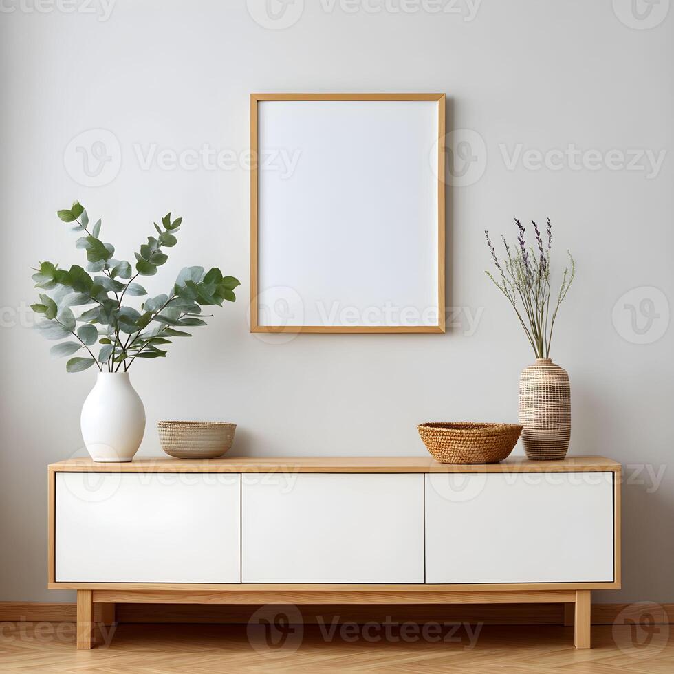 Blank frame for wall art mockup above a modern sideboard with vases and decorative baskets in a stylish interior setting photo