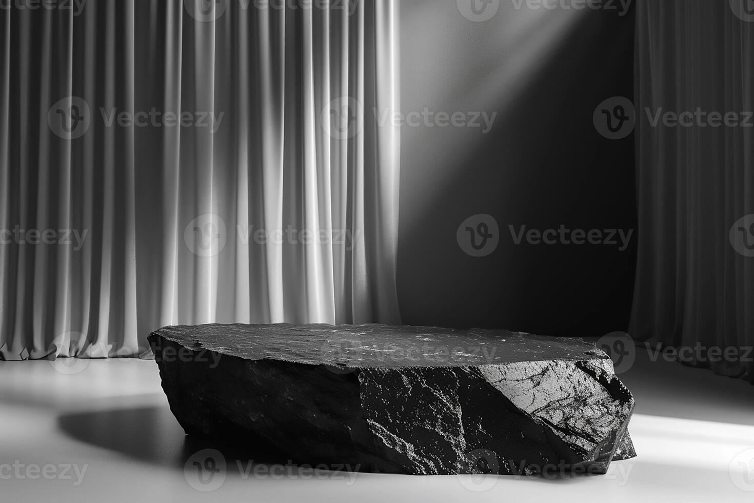 Black stonepodium in a minimalist interior with gray curtains and natural light creating a dramatic atmosphere photo