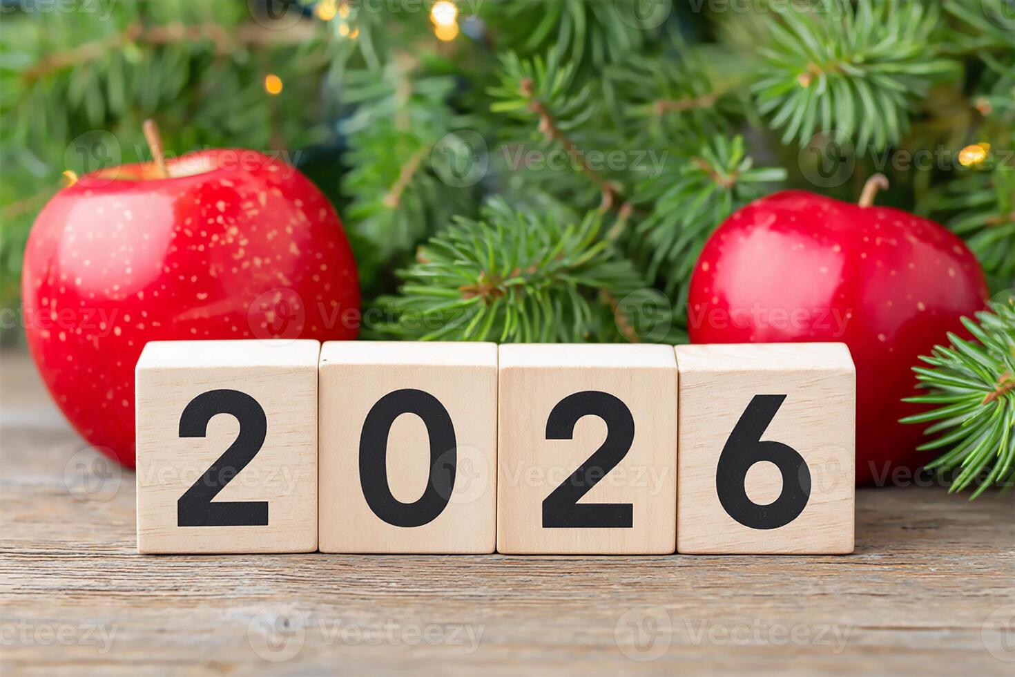 Countdown to the year 2026 with festive decor featuring red apples and evergreen branches nestled on a rustic wooden surface photo