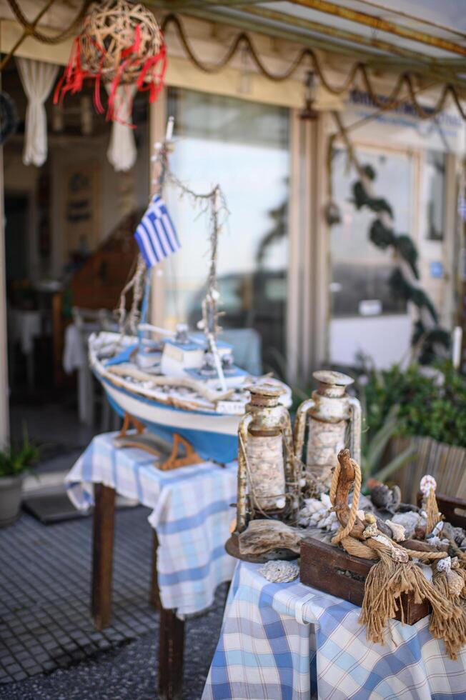 A cozy seaside cafe with wooden tables, maritime decor, and ocean-inspired details, creating a relaxing Mediterranean vibe. photo