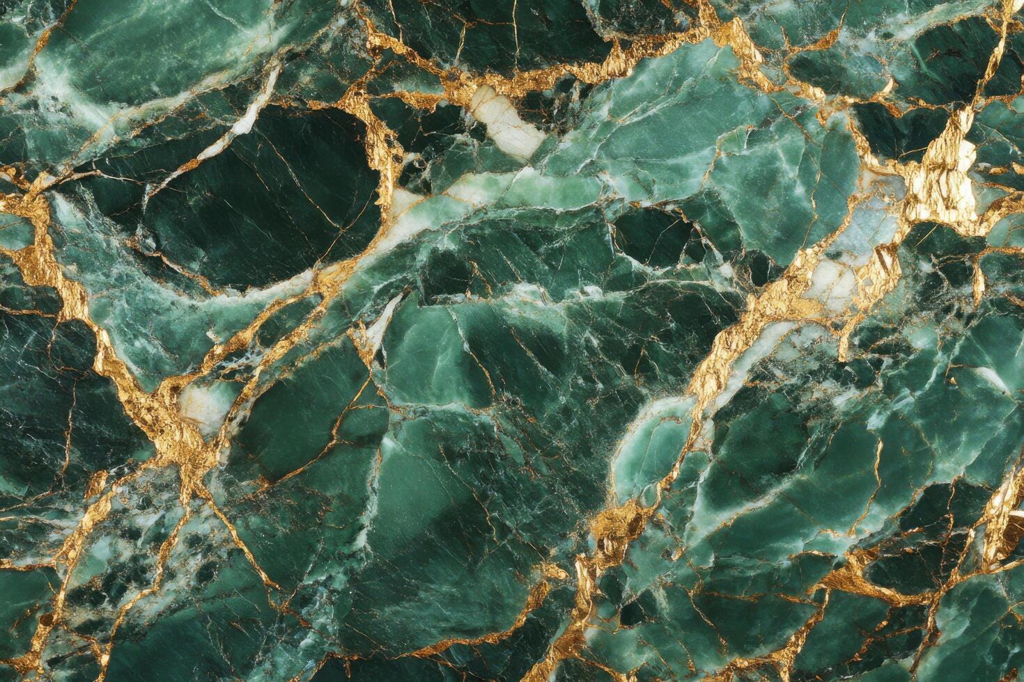 A green marble surface with gold foil photo