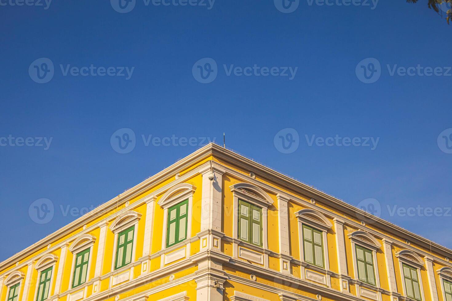Old brick building with facade, under the clear sky Bangkok, Thailand. photo