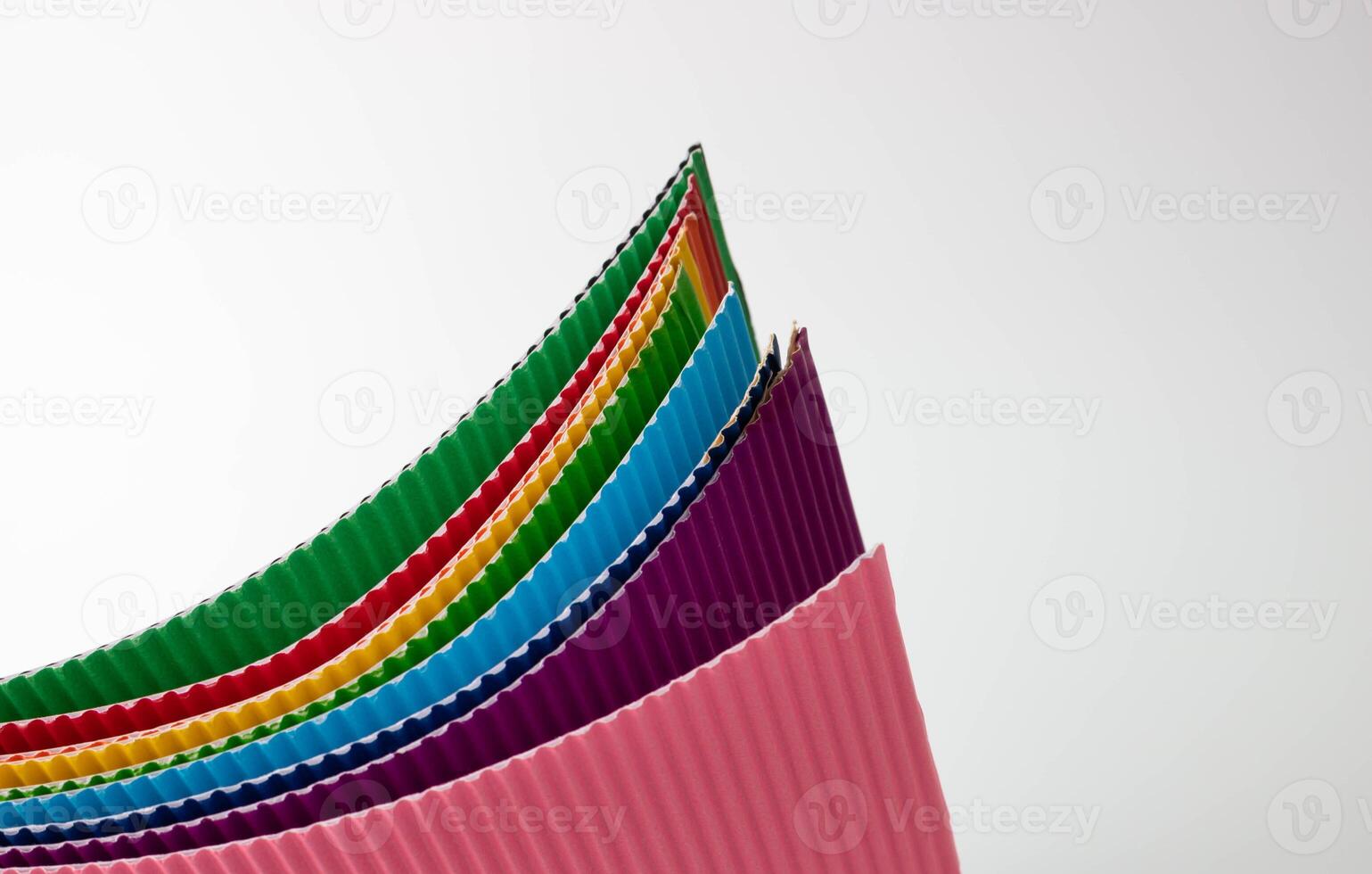A roll of multicolored sheets of corrugated paper. photo
