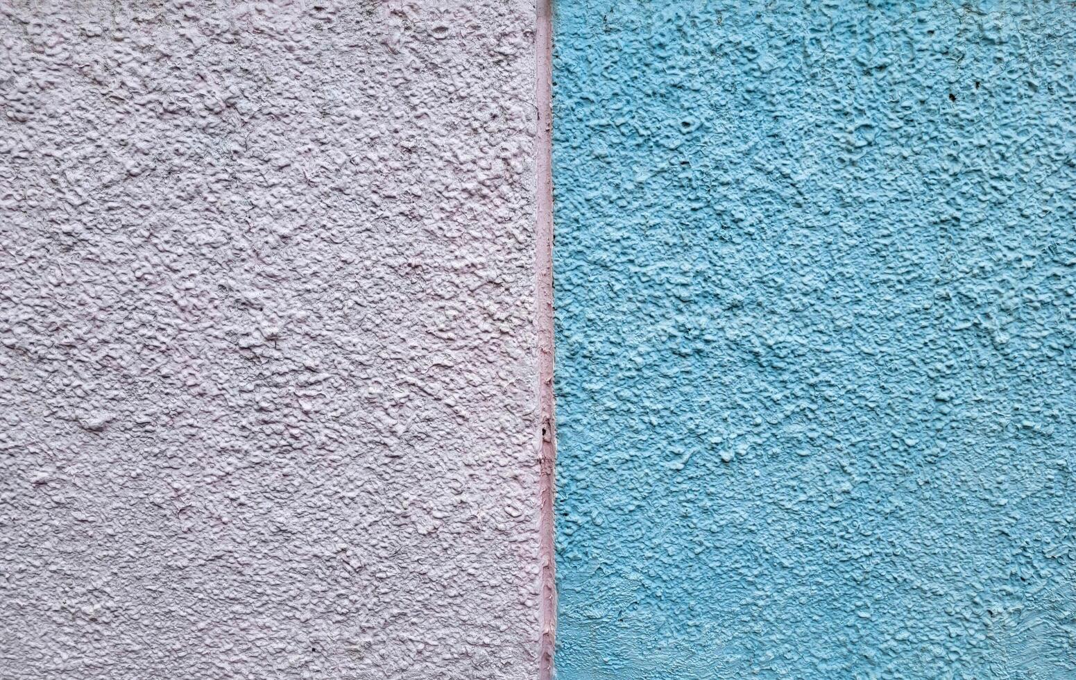 The background is white and blue made of rough decorative plaster photo
