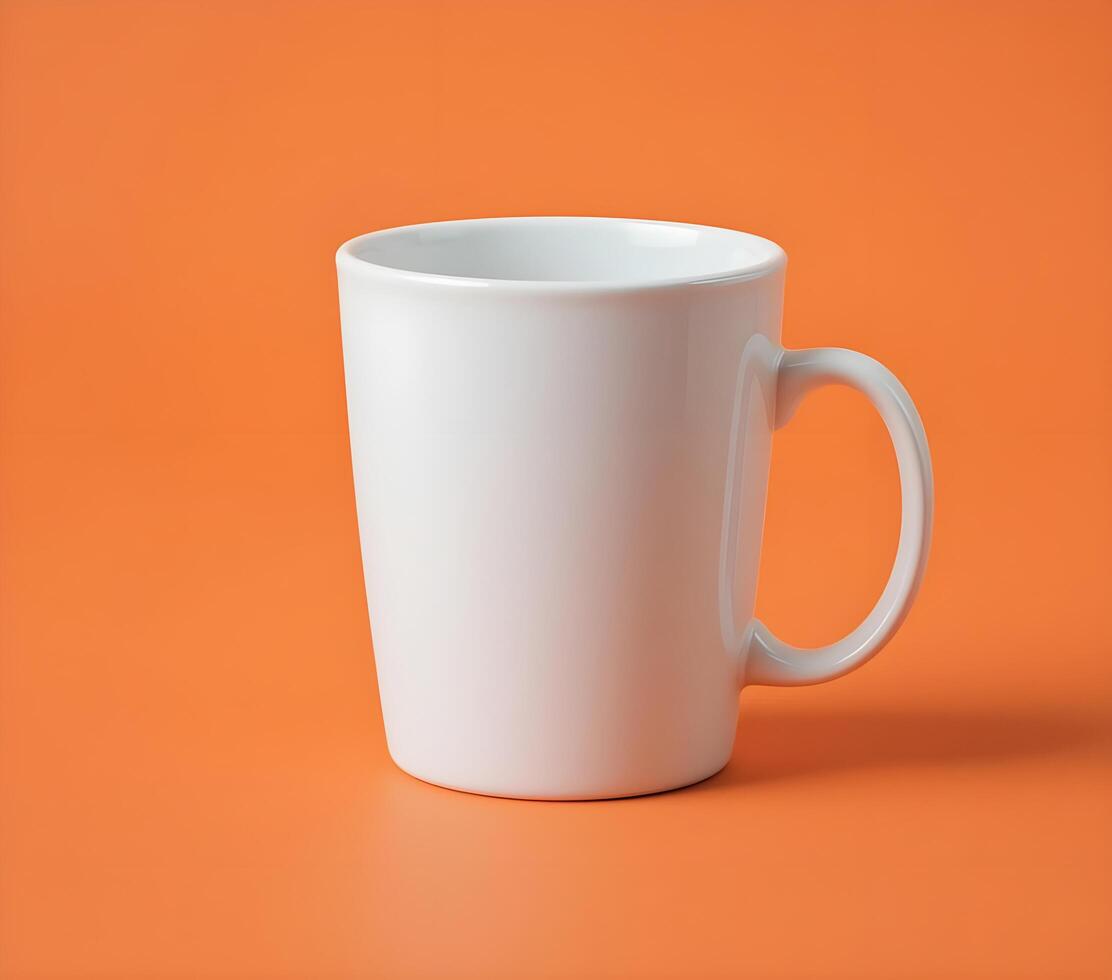 Blank White Mug Against an Orange Background photo