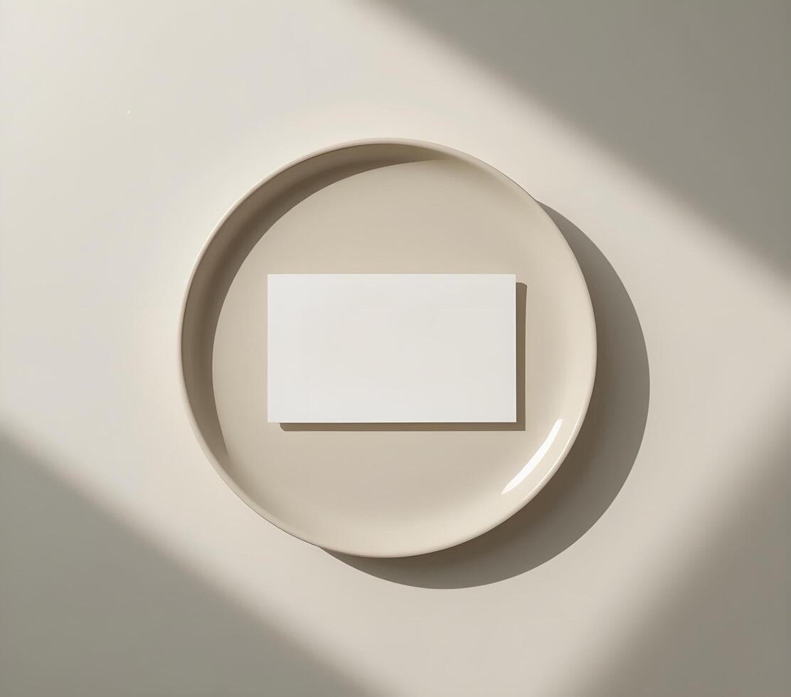 Minimalist Mockup of a Business Card on a Beige Plate photo