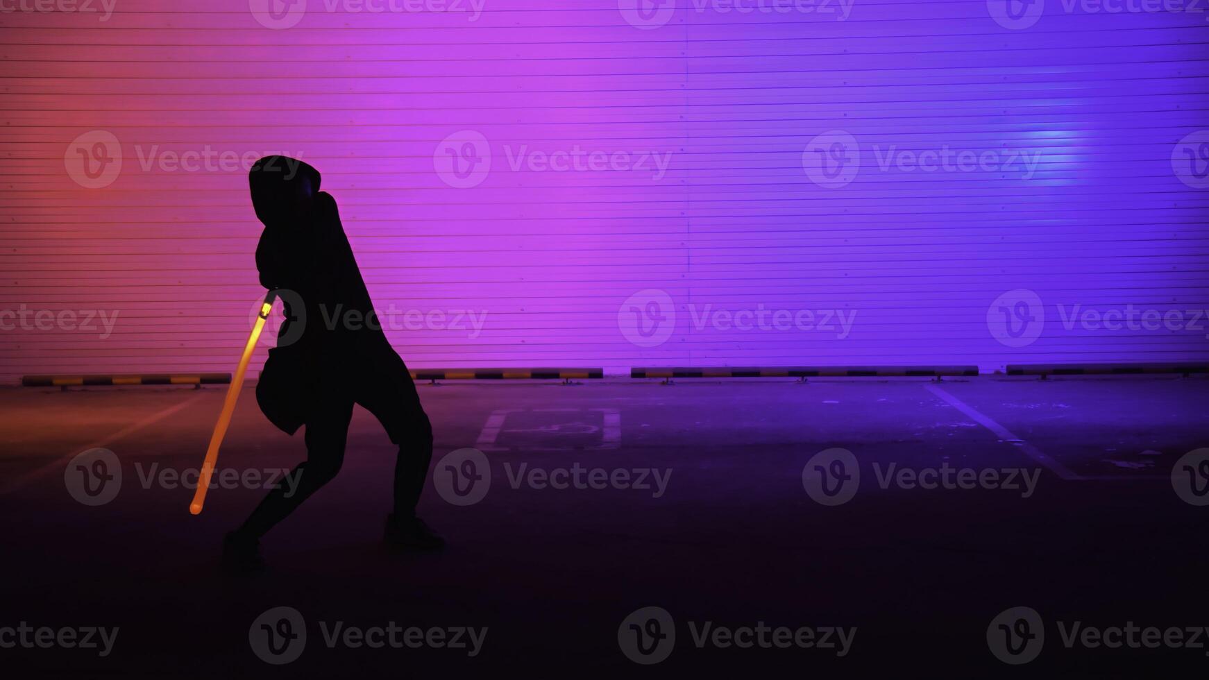 A Dynamic Silhouette illuminated by Neon Lights, wielding a Sword in an engaging scene. Media photo