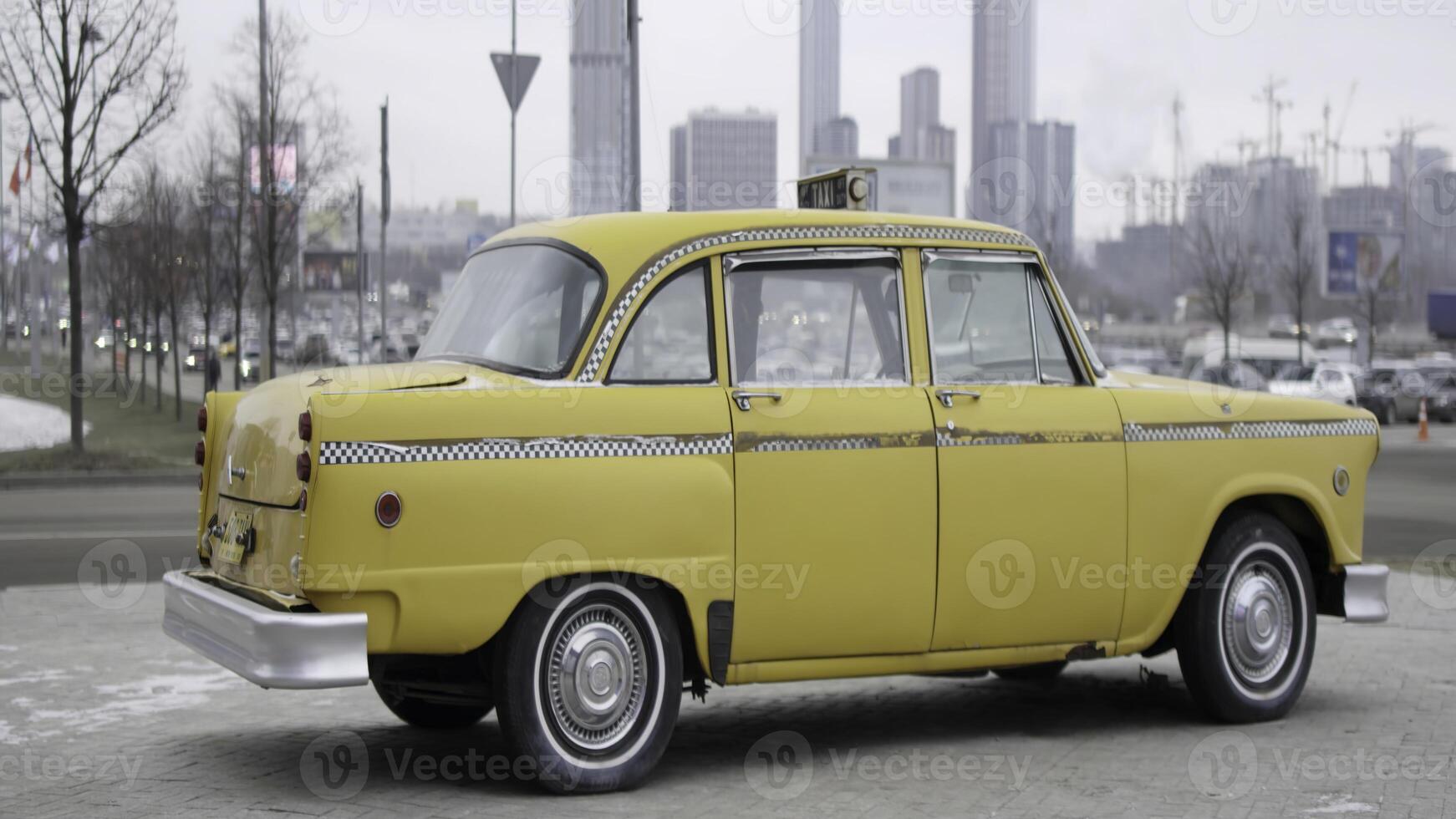 Classic yellow checker cab rotating on display. Action photo