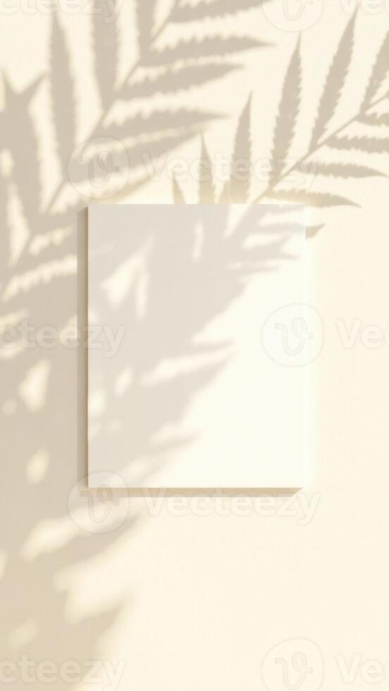 Blank canvas with soft shadows from palm leaves on a light wall creating a serene atmosphere for artistic expression and creativity concept photo