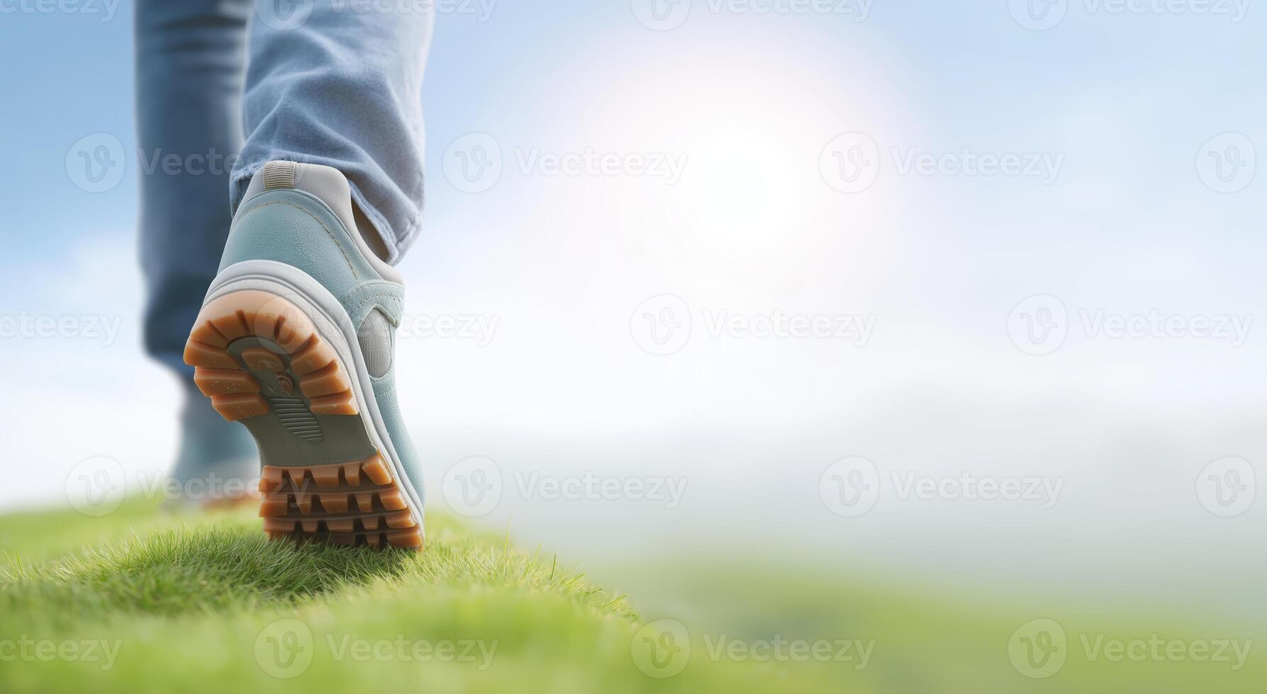 Walking on green grass with hiking boots, enjoying nature and fresh air, exploring the outdoors, healthy lifestyle concept photo