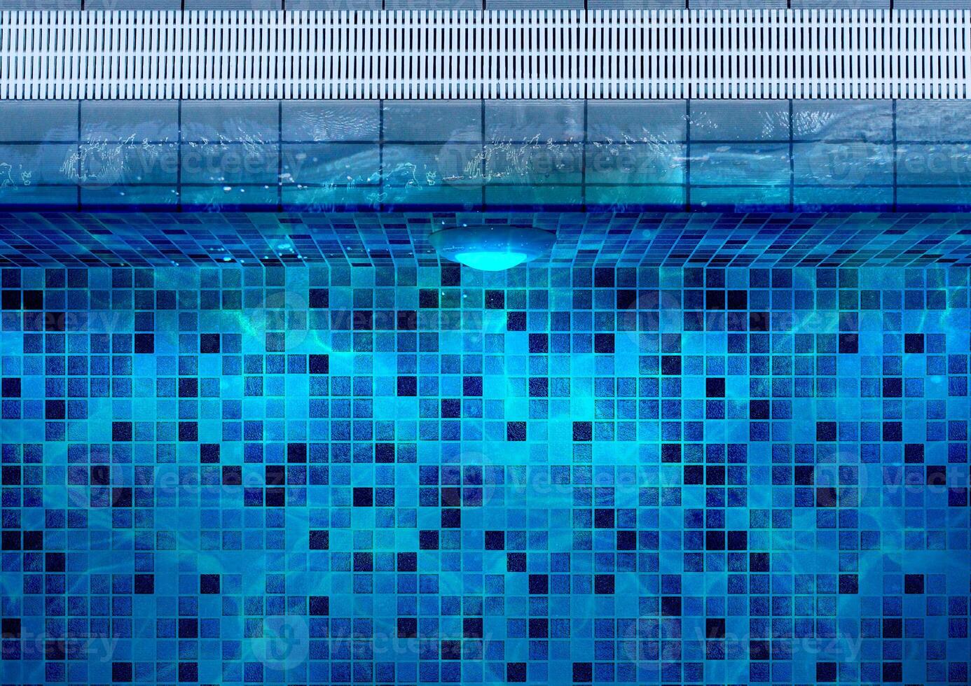 Top View Under Water Swimming Pool Lighting using LED Light with Single Lights at the Floor of Poolside photo