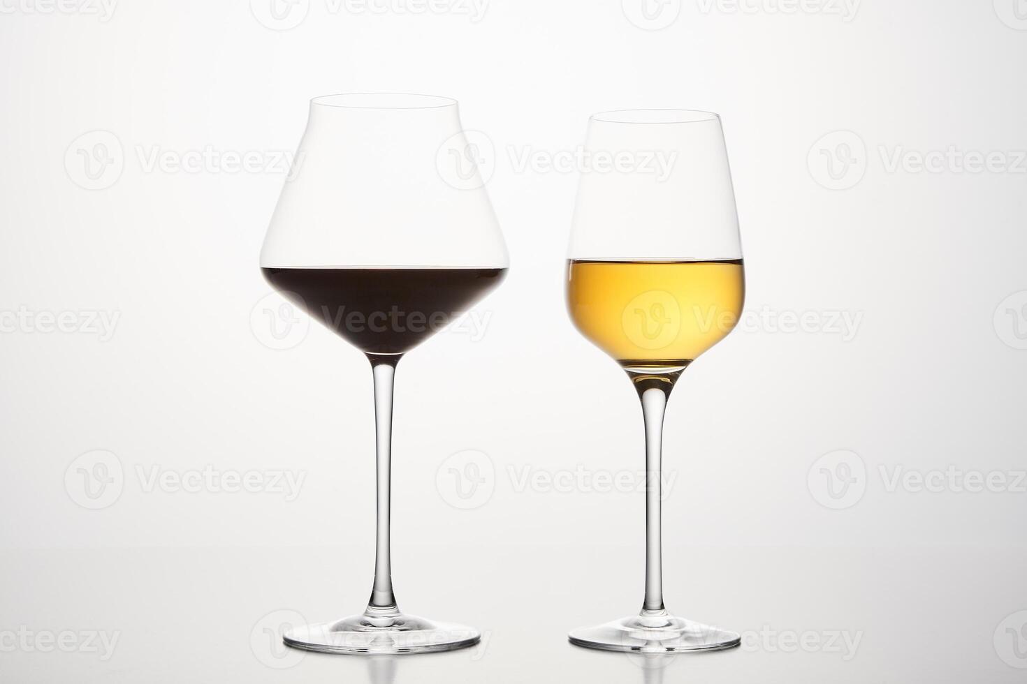 Various shapes of wineglasses with red, white wine. photo