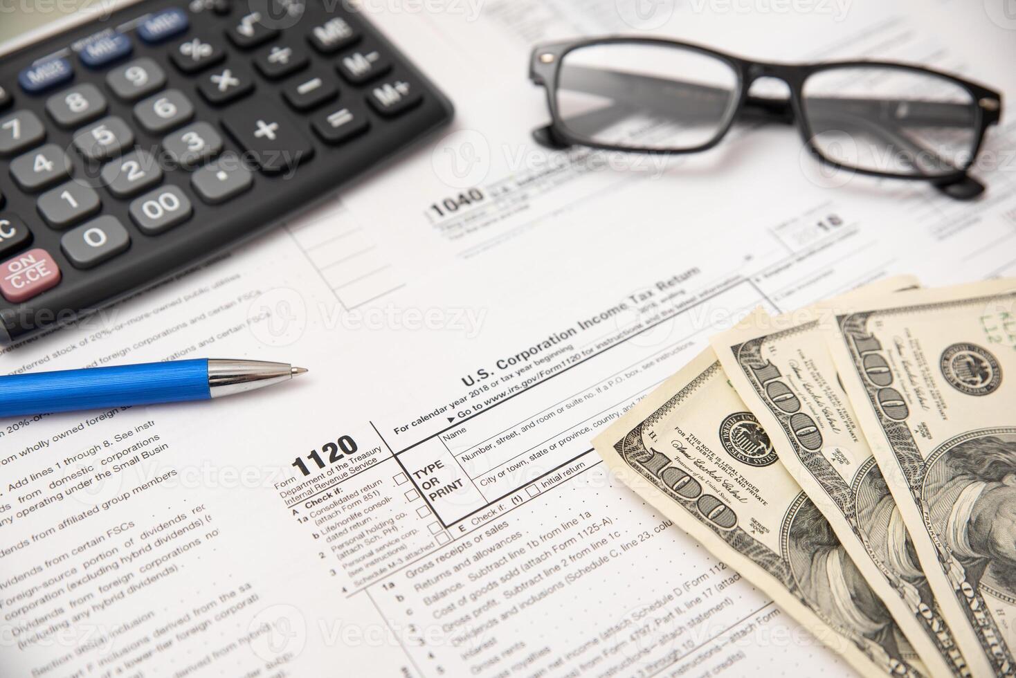 Taxes and glasses on a desk photo
