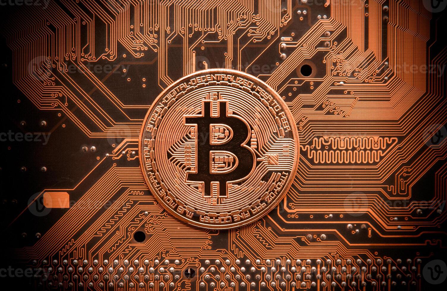 Bitcoin on circuit board photo