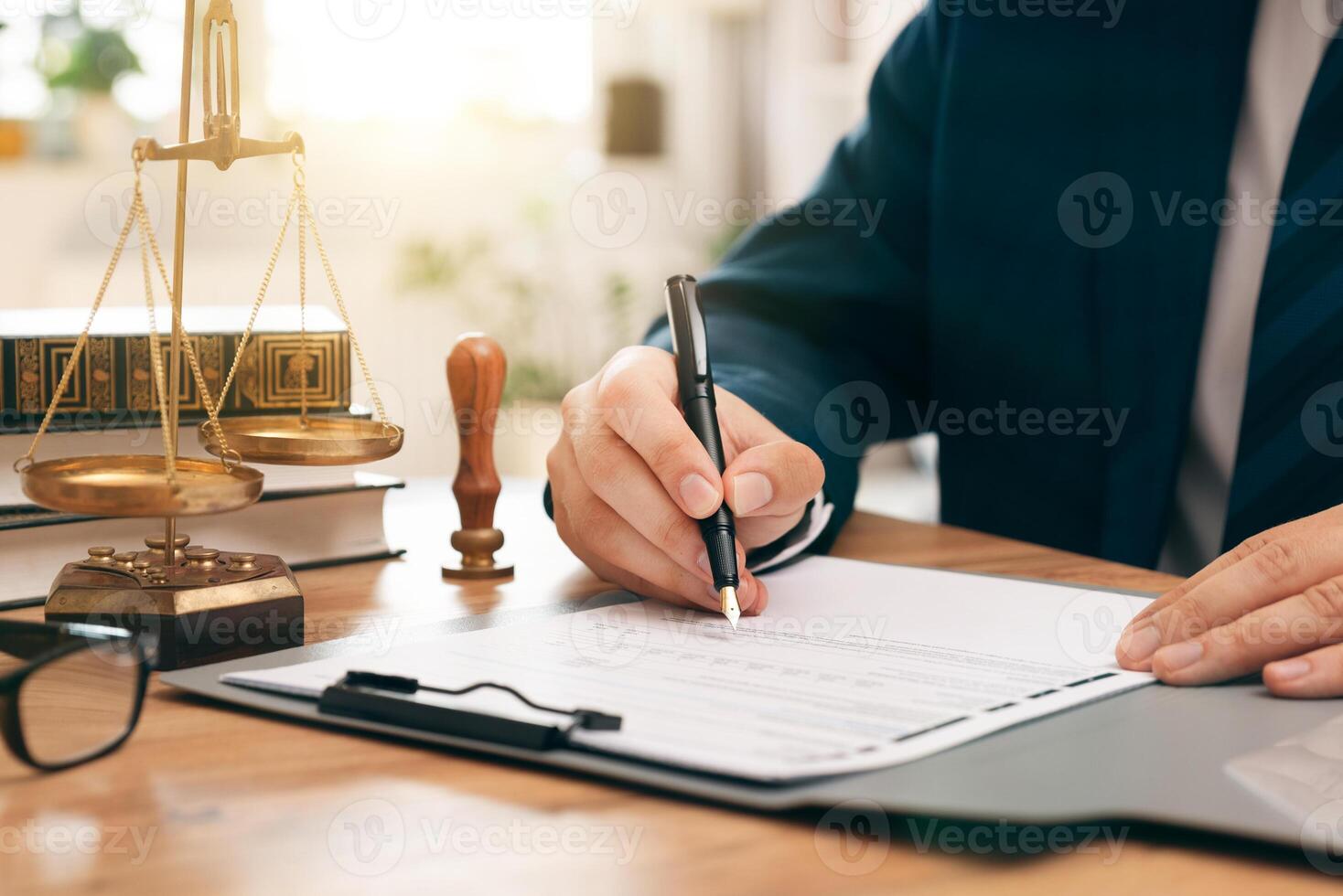 A lawyer signing a contract with a client photo