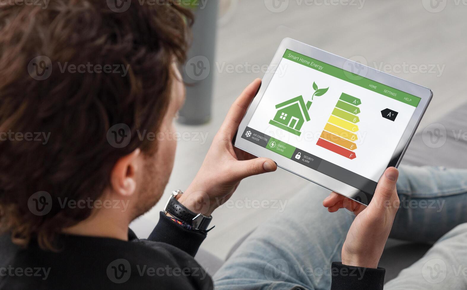 Man using tablet to view energy efficiency photo