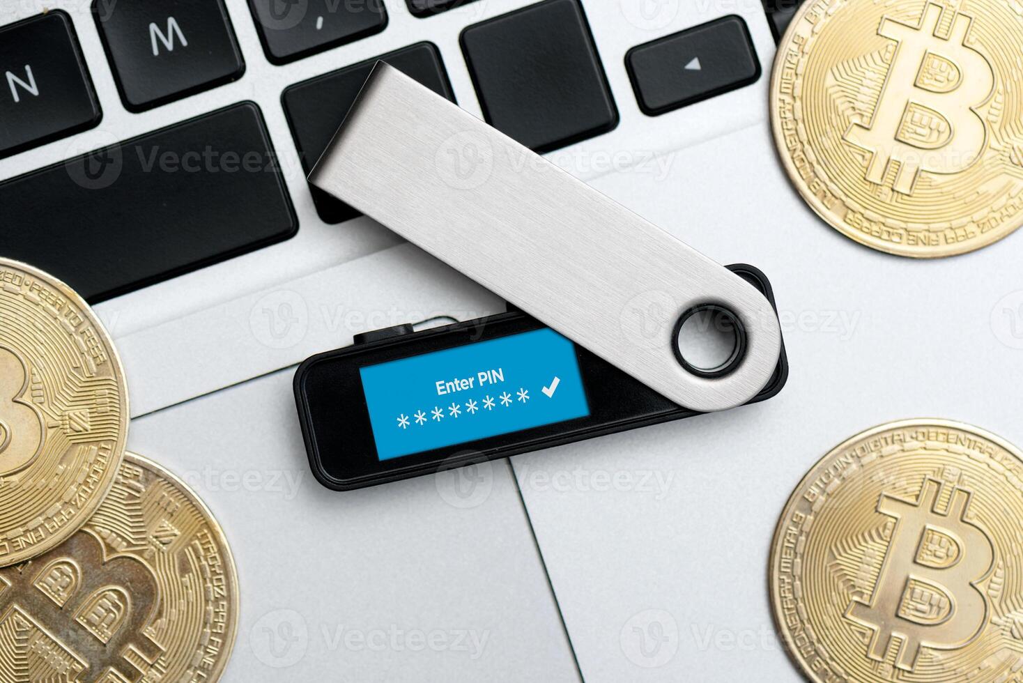 Saving cryptocurrency coins into secure wallet device photo