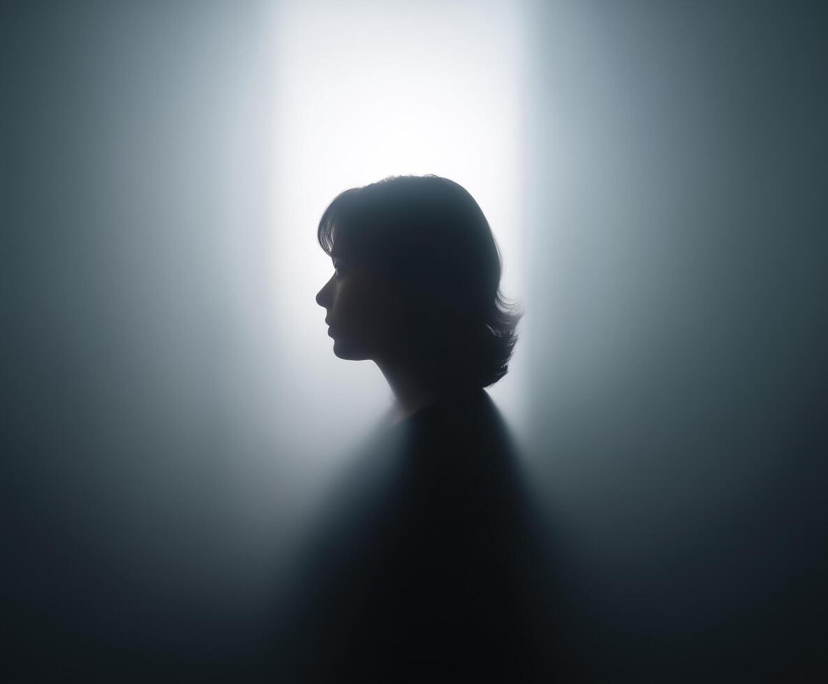 Woman's head is shown in a silhouette photo