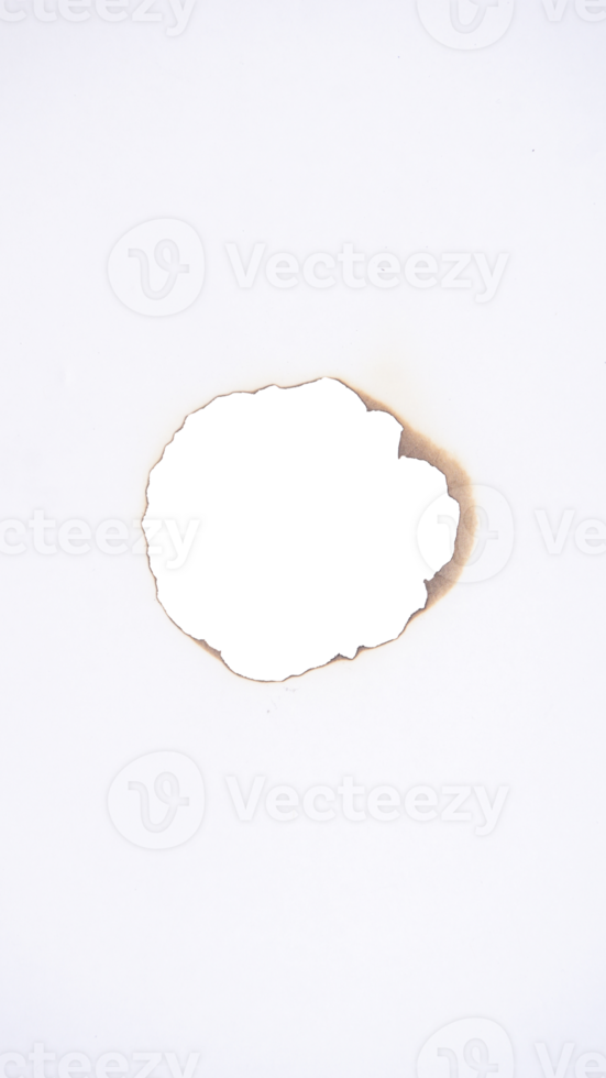 Hole in the burned white paper isolated on transparent background png