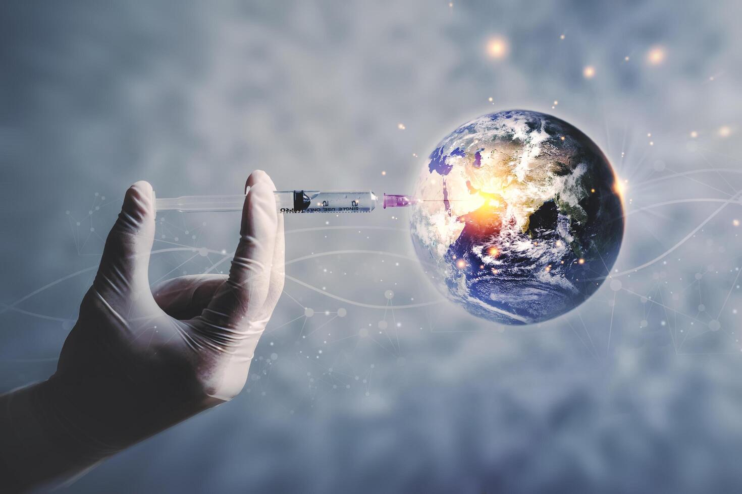 Scientists have vaccinated the Planet Earth Concept of virus Prevention Elements of this image furnished by NASA. photo