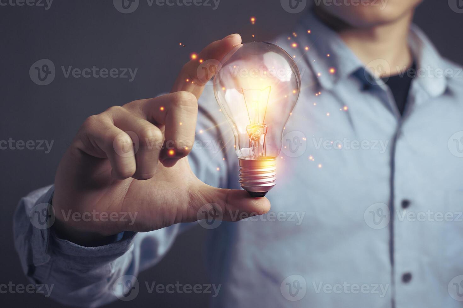 Man holding light bulbs, ideas of new ideas beautiful creative and communicate the new inventions with innovative technology and creativity. concept creativity with bulbs that shine glitter photo
