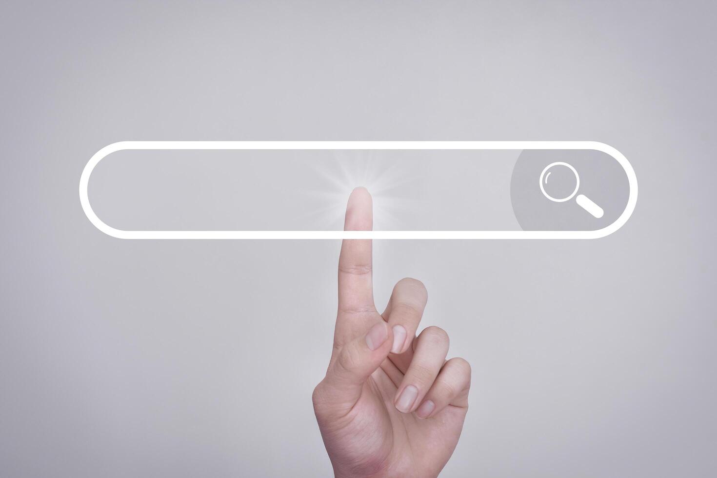 Search button on virtual screen pressed with finger on white background and shows the internet connection, international and global social media. Search concepts searched on the internet. photo
