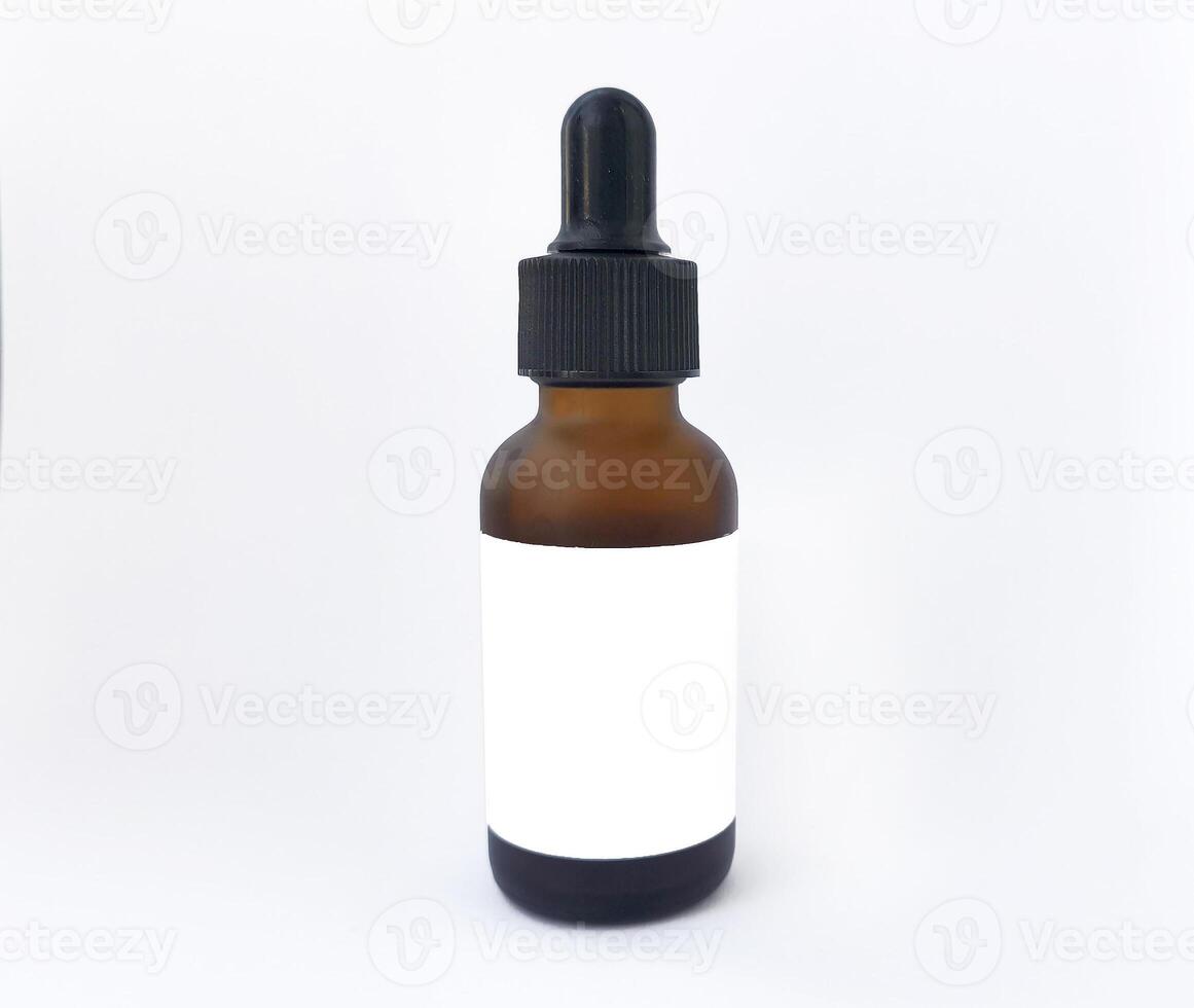 Brown dropper bottle with blank label and pipette isolated on white background, perfect for mockups and advertising of skin care products, essential oils, medicines or cosmetics photo