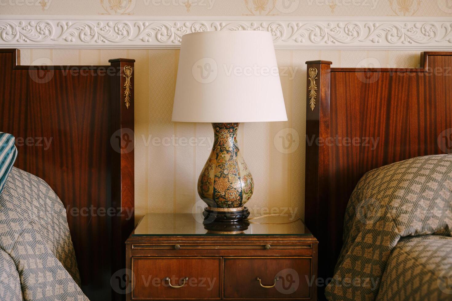 Cozy Bedroom Setting with Elegant Lamp and Bedside Table photo