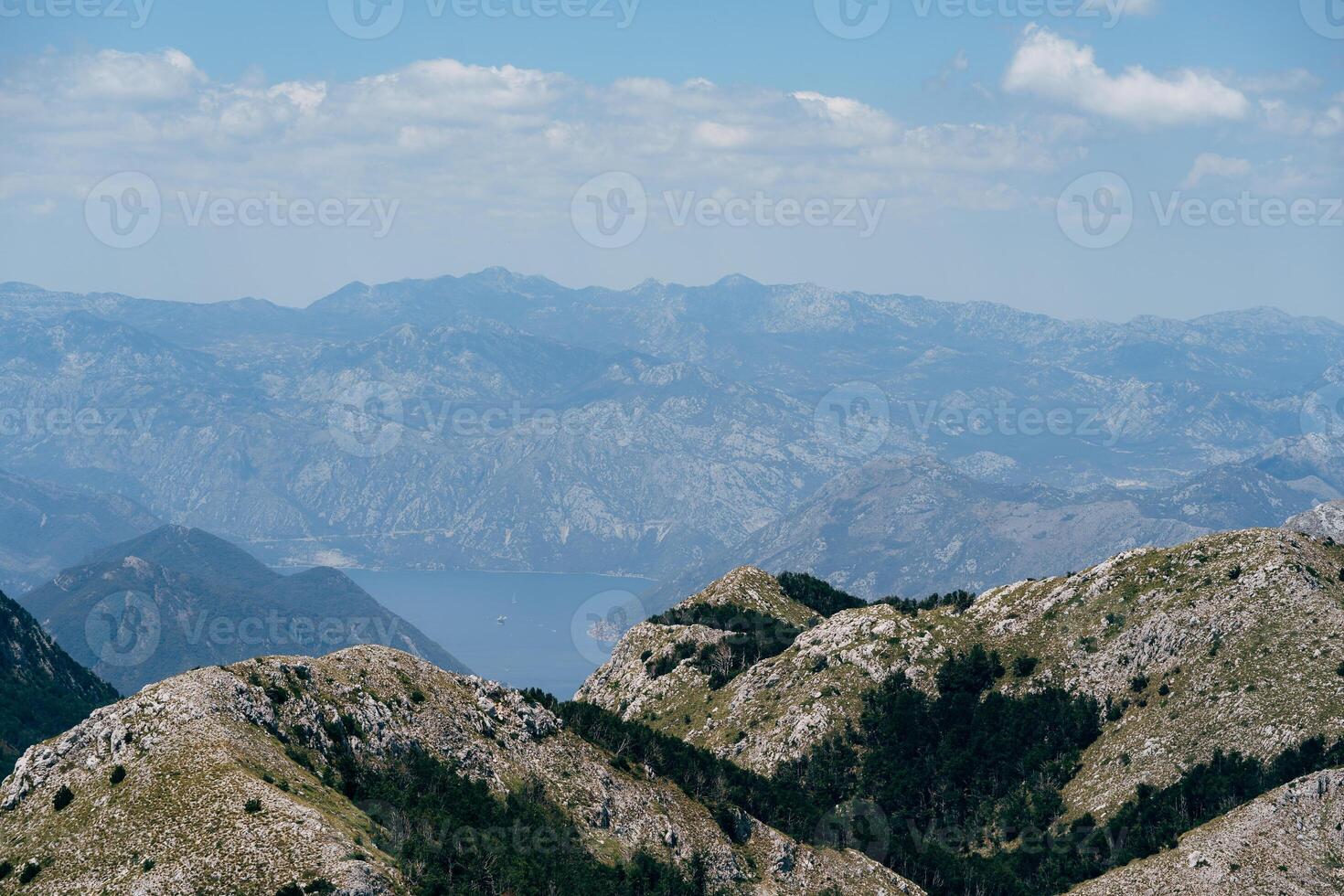 A Vast and Expansive Mountain Landscape Beneath Clear Blue Skies photo