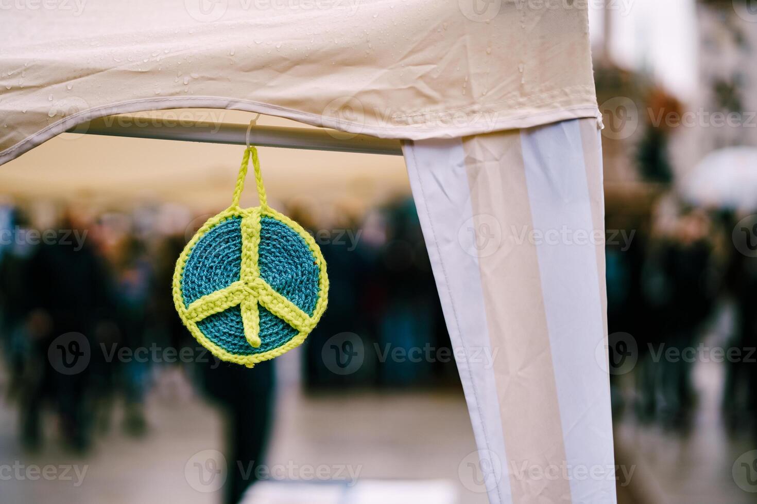 A vibrant and colorful peace symbol is hanging at the event photo