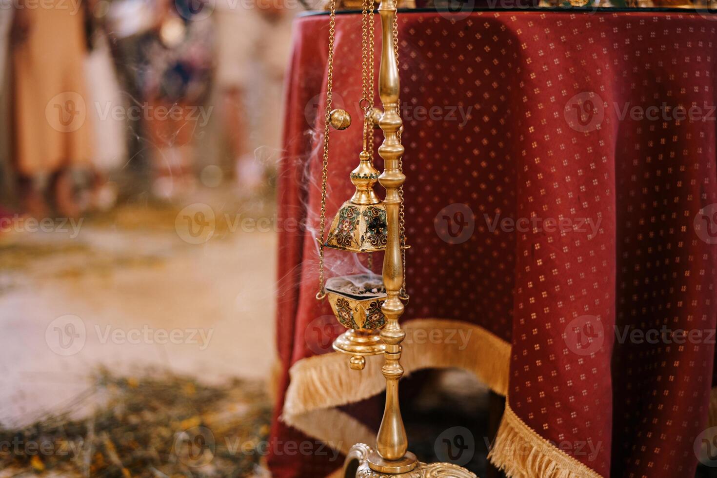 Elegant Brass Incense Holder with Smoke at Cultural Event photo