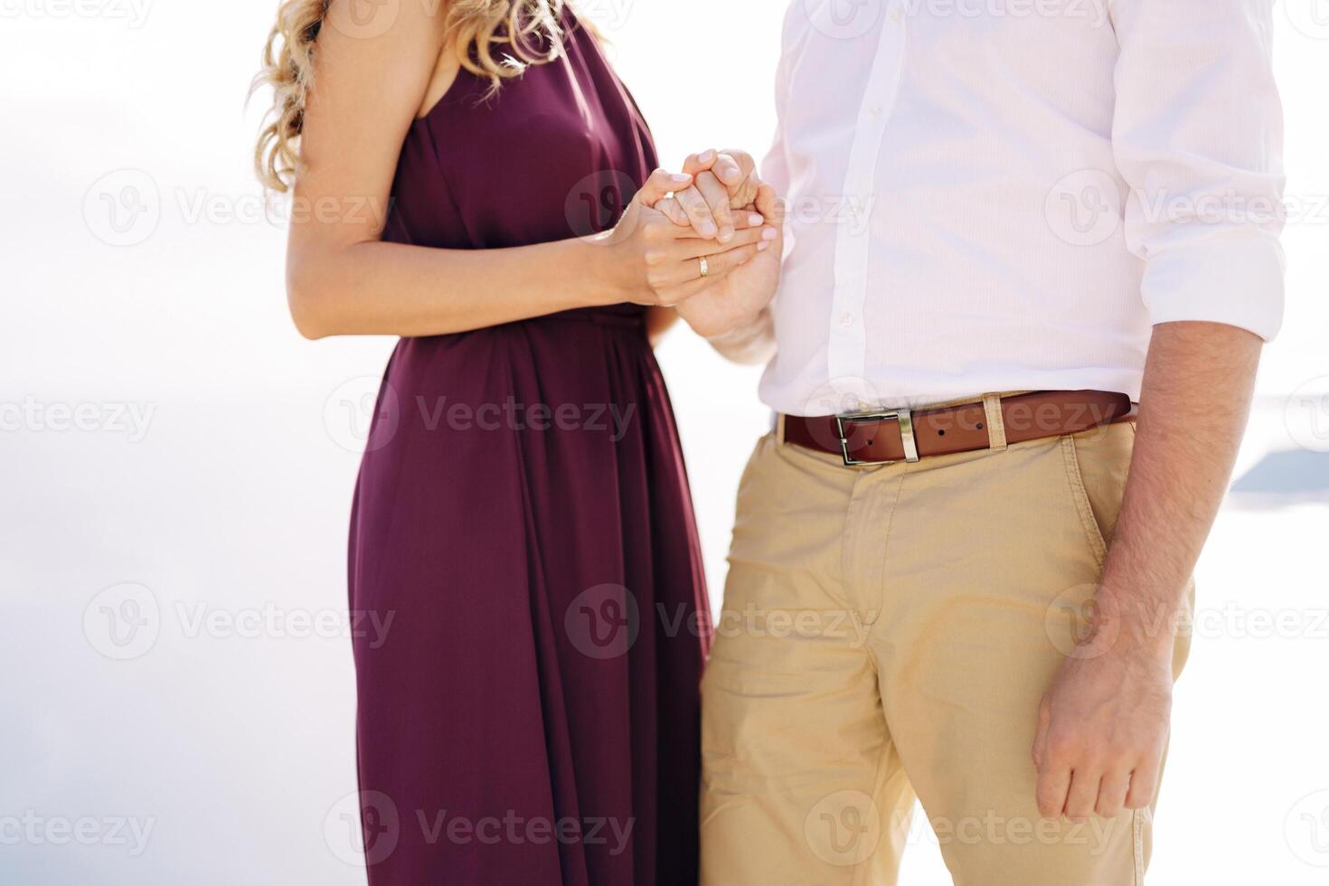 A Romantic Couple Holding Hands at a Beautiful Beach Location photo