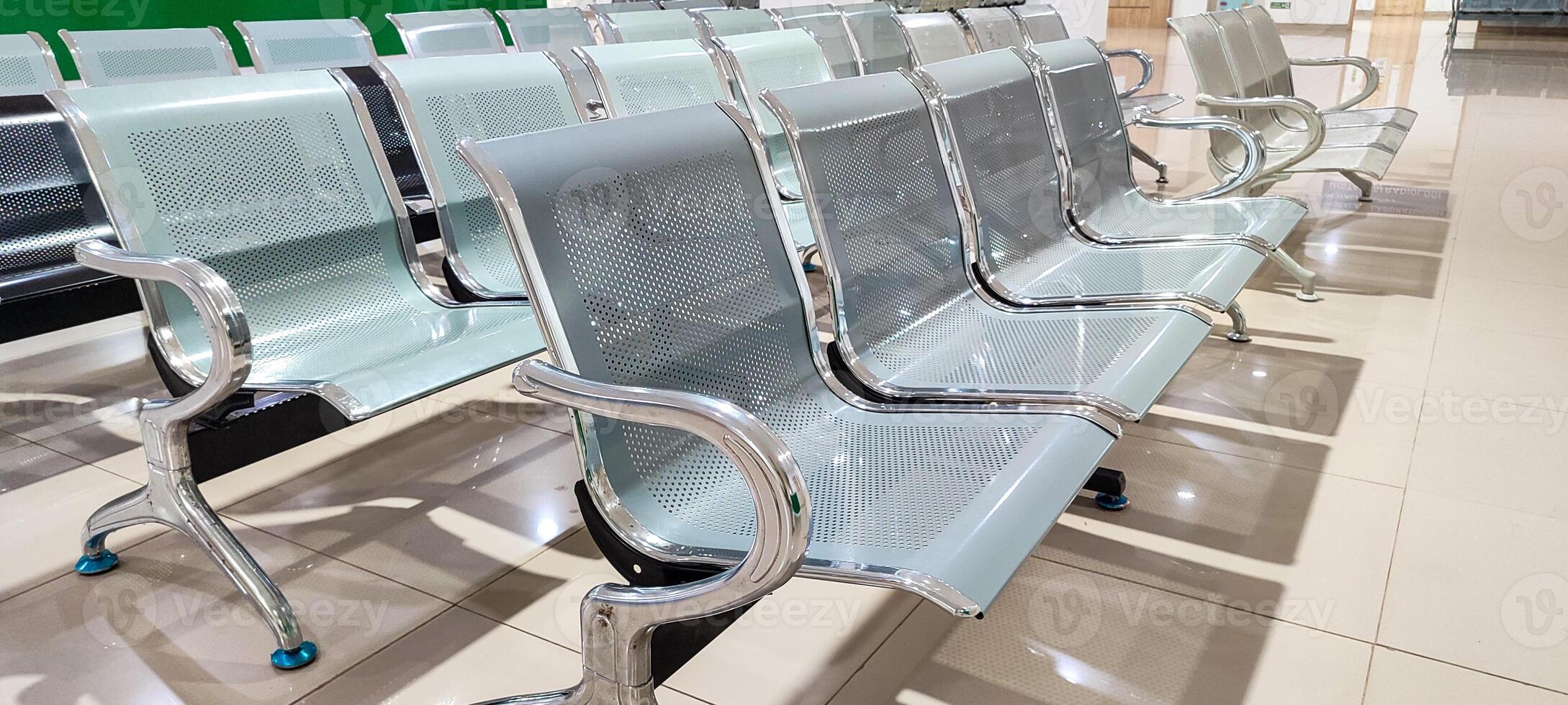 Landscape photo of patient waiting chairs in a hospital waiting room, looks clean and spacious,